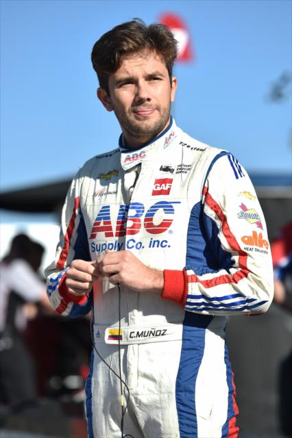 Carlos Munoz stands along pit lane prior to the final practice for the ABC Supply 500 at Pocono Raceway -- Photo by: Chris Owens