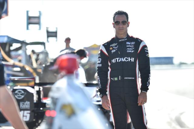 Helio Castroneves looks over his No. 3 Hitachi Chevrolet on pit lane prior to the final practice for the ABC Supply 500 at Pocono Raceway -- Photo by: Chris Owens