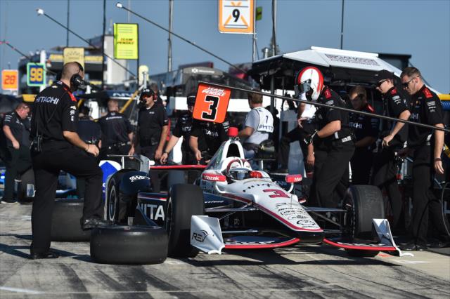Team Penske look over the Chevrolet of Helio Castroneves on pit lane during practice for the ABC Supply 500 at Pocono Raceway -- Photo by: Chris Owens