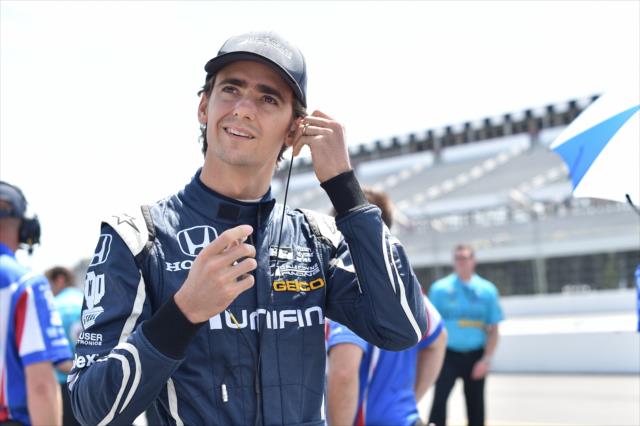 Esteban Gutierrez sets his earpieces on pit lane prior to practice for the ABC Supply 500 at Pocono Raceway -- Photo by: Chris Owens