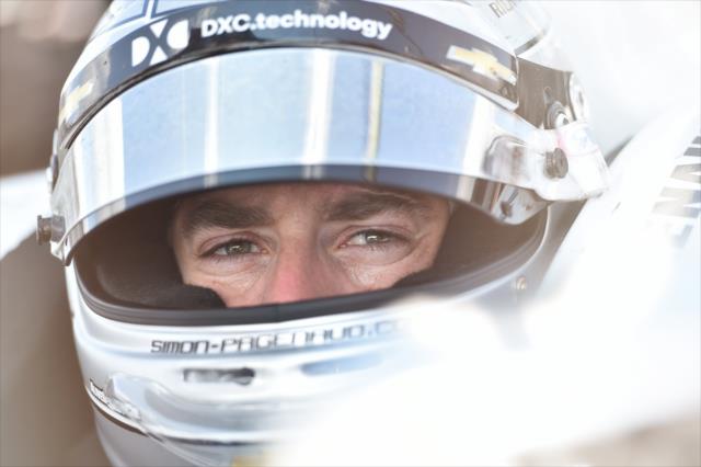 Simon Pagenaud peers over to his pit stand prior to practice for the ABC Supply 500 at Pocono Raceway -- Photo by: Chris Owens