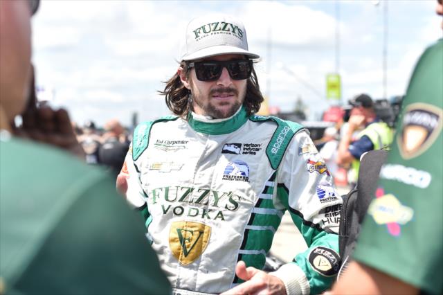 JR Hildebrand chats with his team engineers along pit lane prior to practice for the ABC Supply 500 at Pocono Raceway -- Photo by: Chris Owens