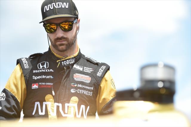 James Hinchcliffe looks over his No. 5 Arrow Honda on pit lane prior to practice for the ABC Supply 500 at Pocono Raceway -- Photo by: Chris Owens