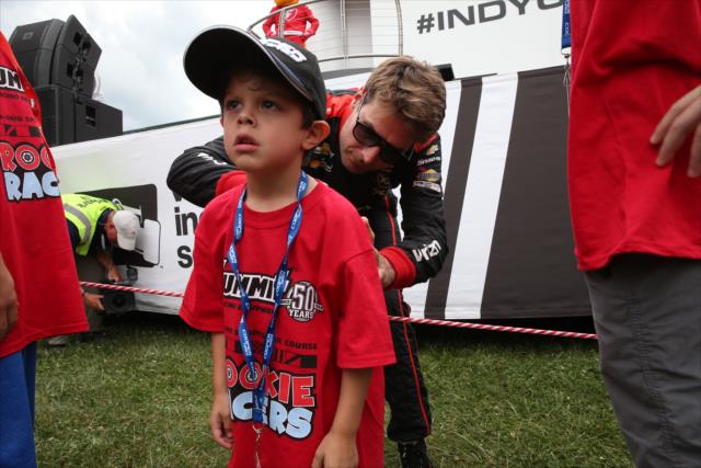 A young fan gets an autograph from Will Power during pre-race introductions for the Honda Indy 200 at Mid-Ohio -- Photo by: Chris Jones