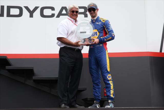 Alexander Rossi accepts the Verizon P1 Award for winning the pole position during pre-race festivities for the Honda Indy 200 at Mid-Ohio -- Photo by: Chris Jones
