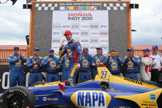 Alexander Rossi and his Andretti Autosport crew celebrate in Victory Circle after winning the Honda Indy 200 at Mid-Ohio -- Photo by: Chris Jones