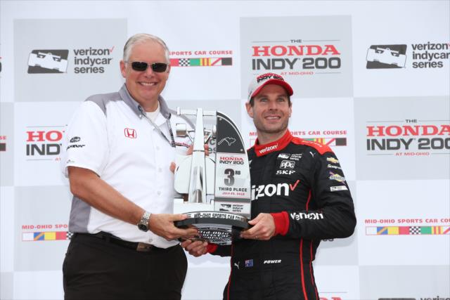 Will Power accepts his 3rd Place trophy in Victory Circle following the Honda Indy 200 at Mid-Ohio -- Photo by: Chris Jones