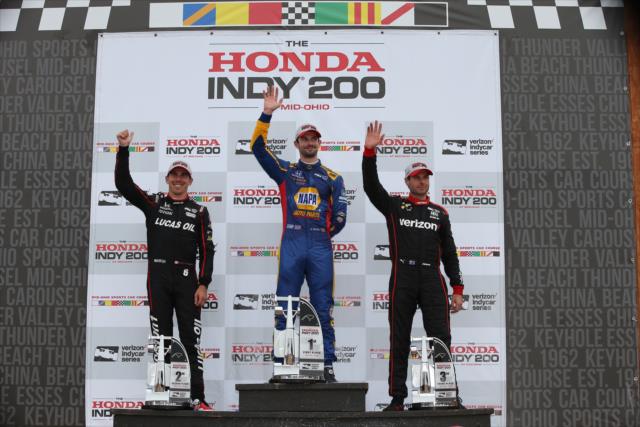 Alexander Rossi, Robert Wickens, and Will Power waive to the crowd in Victory Circle following the Honda Indy 200 at Mid-Ohio -- Photo by: Chris Jones
