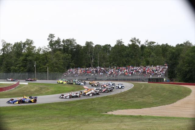 Alexander Rossi leads the field through Madness (Turns 4-5) during the start of the Honda Indy 200 at Mid-Ohio -- Photo by: Chris Jones