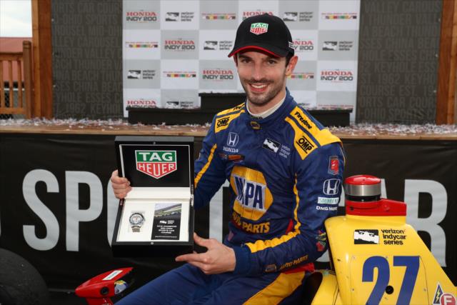 Alexander Rossi with his TAG Heuer winner's watch in Victory Circle after winning the Honda Indy 200 at Mid-Ohio -- Photo by: Chris Jones