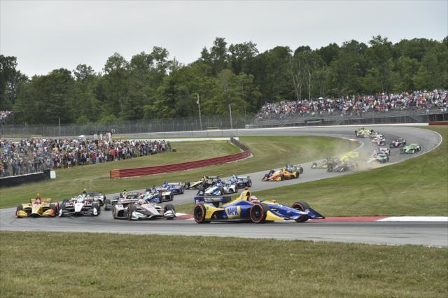 Alexander Rossi leads the field through Madness (Turns 4-5) during the start of the Honda Indy 200 at Mid-Ohio -- Photo by: Chris Owens