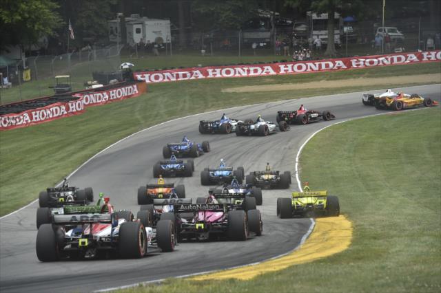 The field streams down the Turn 5 hill into Turn 6 during the start of the Honda Indy 200 at Mid-Ohio -- Photo by: Chris Owens