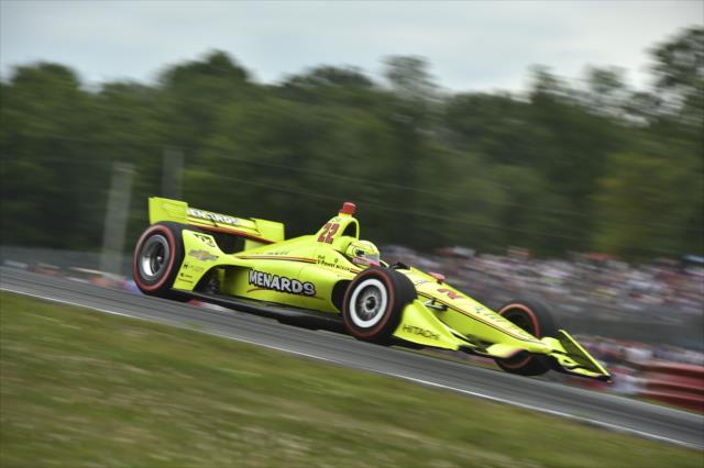 Simon Pagenaud launches over the Turn 5 hill during the Honda Indy 200 at Mid-Ohio -- Photo by: Chris Owens