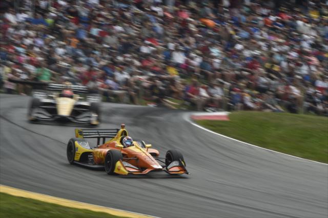Zach Veach and James Hinchcliffe launch over the Turn 5 hill during the Honda Indy 200 at Mid-Ohio -- Photo by: Chris Owens