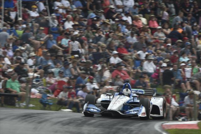 Graham Rahal launches over the Turn 5 hill during the Honda Indy 200 at Mid-Ohio -- Photo by: Chris Owens