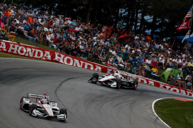 Will Power and Josef Newgarden sail over the Turn 5 hill during the Honda Indy 200 at Mid-Ohio -- Photo by: Joe Skibinski