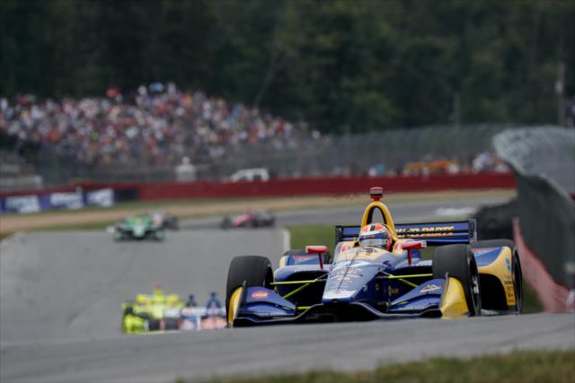 Alexander Rossi leads the field into the Keyhole Turn (Turn 2) during the Honda Indy 200 at Mid-Ohio -- Photo by: Joe Skibinski