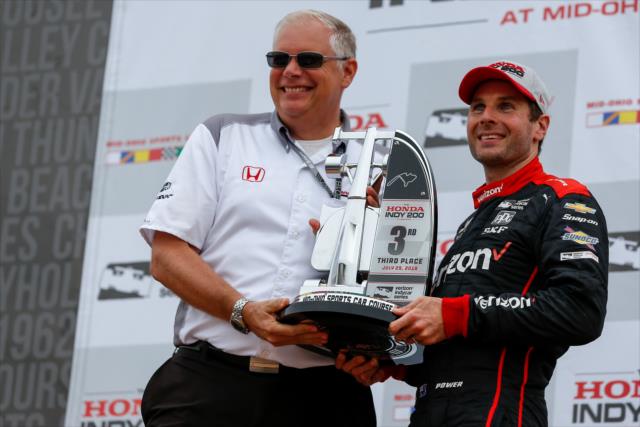 Will Power accepts his 3rd Place trophy in Victory Cirlce following the Honda Indy 200 at Mid-Ohio -- Photo by: Joe Skibinski