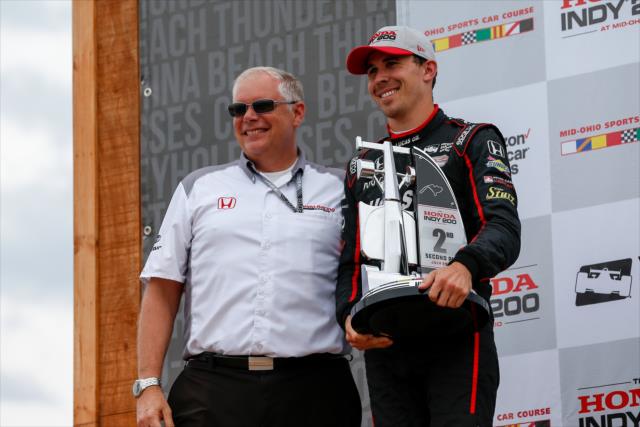 Robert Wickens accepts his 2nd Place trophy in Victory Circle following the Honda Indy 200 at Mid-Ohio -- Photo by: Joe Skibinski