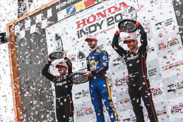 The confetti flies for Alexander Rossi, Robert Wickens, and Will Power in Victory Circle following the Honda Indy 200 at Mid-Ohio -- Photo by: Joe Skibinski
