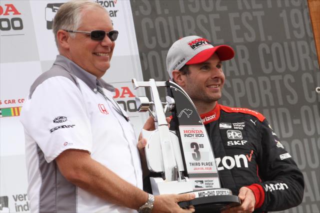 Will Power accepts his 3rd Place trophy in Victory Circle following the Honda Indy 200 at Mid-Ohio -- Photo by: Matt Fraver