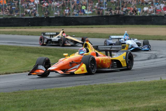 Zach Veach leads a group through the exit of the Keyhole Turn (Turn 2) during the Honda Indy 200 at Mid-Ohio -- Photo by: Matt Fraver
