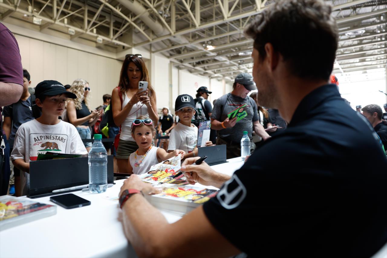 Romain Grosjean signs an autograph for a fan - Honda Indy Toronto - By: Joe Skibinski -- Photo by: Joe Skibinski