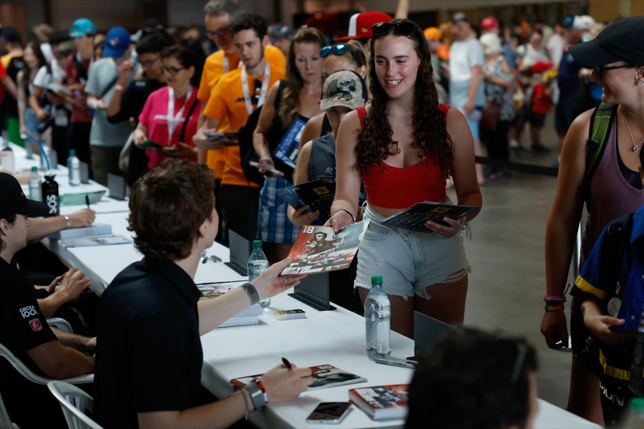 David Malukas signs an autograph for a fan - Honda Indy Toronto - By: Joe Skibinski -- Photo by: Joe Skibinski
