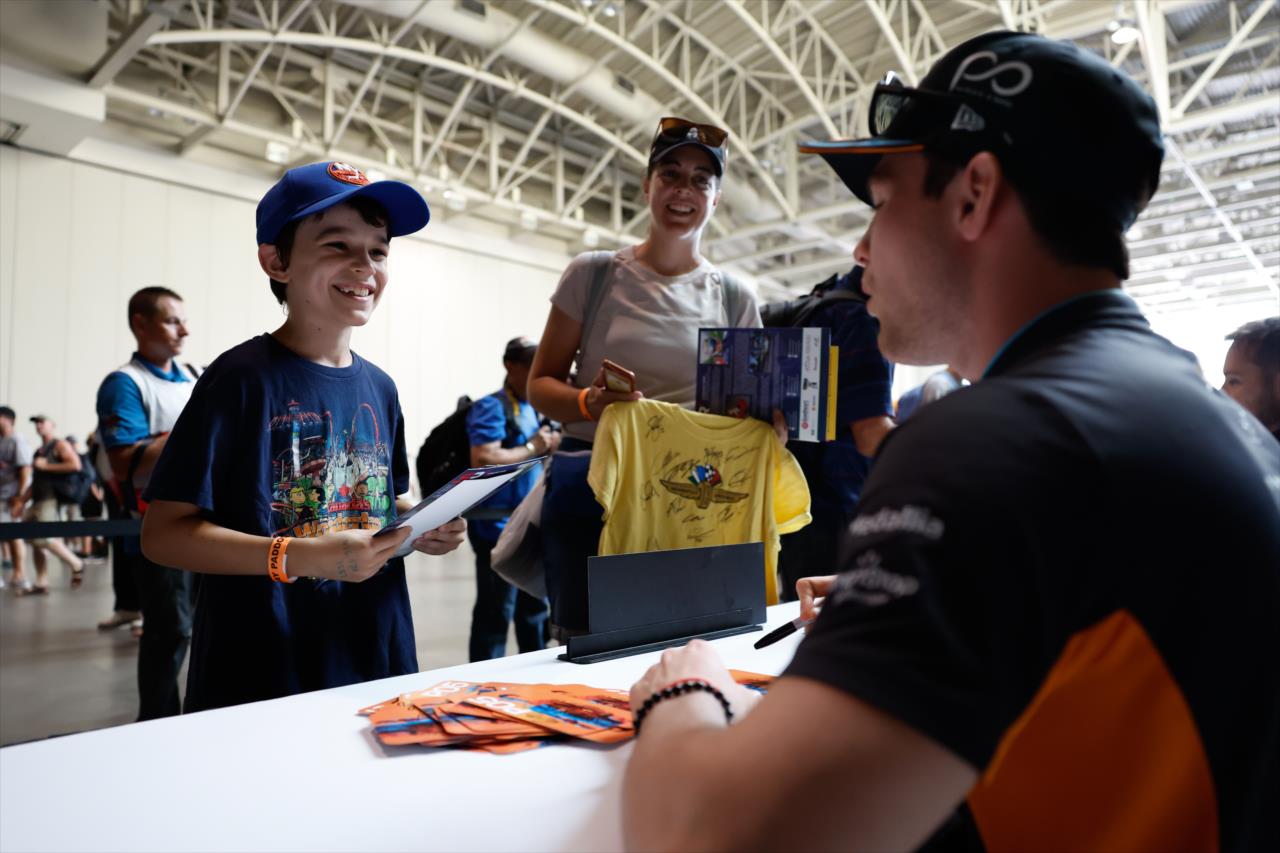 Pato O'Ward signs an autograph for a fan - Honda Indy Toronto - By: Joe Skibinski -- Photo by: Joe Skibinski
