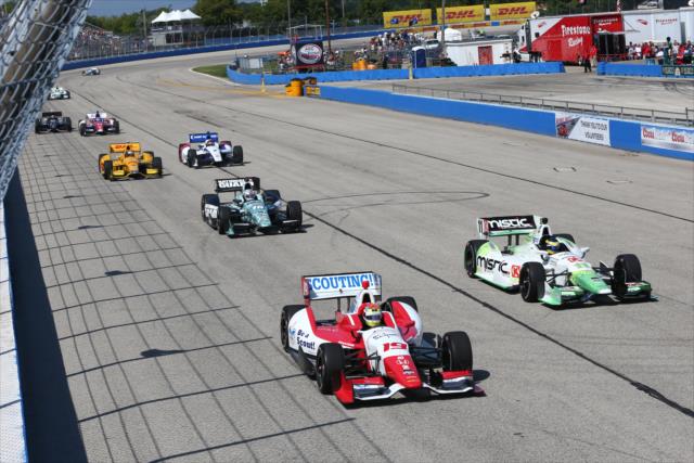 Justin Wilson and Sebastien Bourdais go side-by-side at the start of the ABC Supply Wisconsin 250 at the Milwaukee Mile -- Photo by: Chris Jones