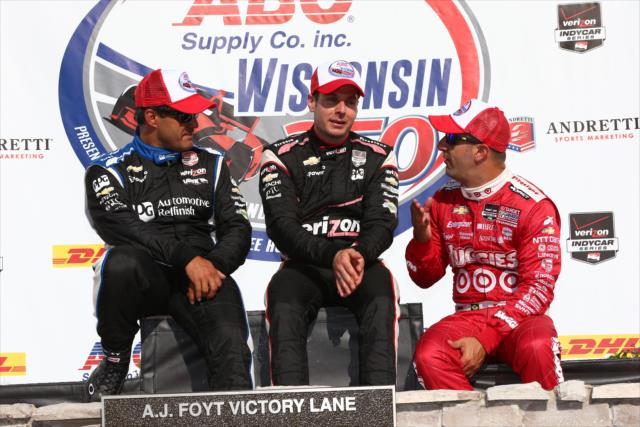 Juan Pablo Montoya, Will Power, and Tony Kanaan chat on Victory Lane after the ABC Supply Wisconsin 250 at the Milwaukee Mile -- Photo by: Chris Jones
