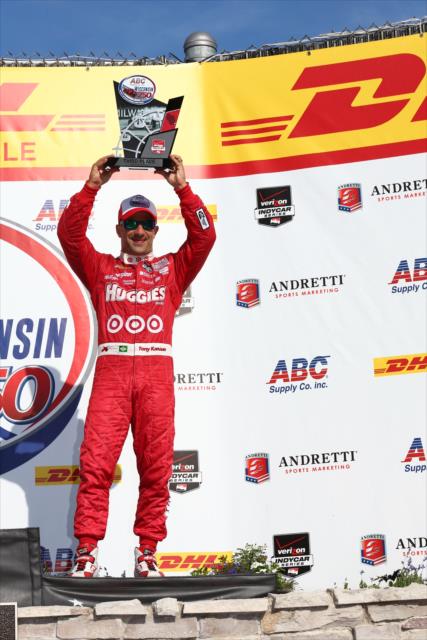 Tony Kanaan hoists his 3rd Place trophy in Victory Lane following the ABC Supply Wisconsin 250 at the Milwaukee Mile -- Photo by: Chris Jones