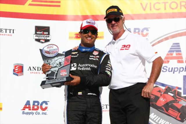 Juan Pablo Montoya receives his 2nd Place trophy in Victory Lane following the ABC Supply Wisconsin 250 at the Milwaukee Mile -- Photo by: Chris Jones