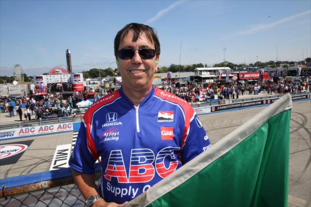 Keith Rozolis, CEO of ABC Supply, is the honorary green flag starter of the ABC Supply Wisconsin 250 at the Milwaukee Mile -- Photo by: Chris Jones