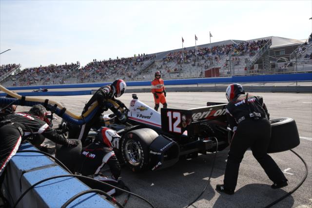 The Team Penske crew go to work on Will Power's machine at the Milwaukee Mile -- Photo by: Chris Jones