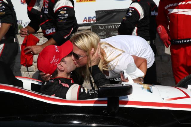 Will Power gets a victory kiss from his wife, Liz, in Victory Lane after winning the ABC Supply Wisconsin 250 at the Milwaukee Mile -- Photo by: Chris Jones