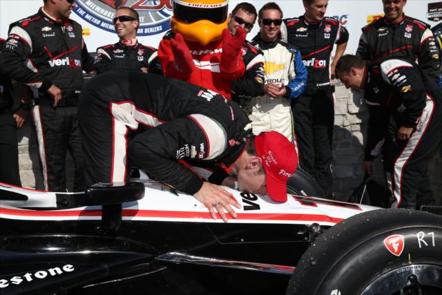 Will Power gives his machine a celebratory kiss in Victory Lane after winning the ABC Supply Wisconsin 250 at the Milwaukee Mile -- Photo by: Chris Jones