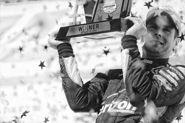 Will Power hoists his Winner's Trophy in Victory Circle after winning the ABC Supply Wisconsin 250 at the Milwaukee Mile -- Photo by: Shawn Gritzmacher