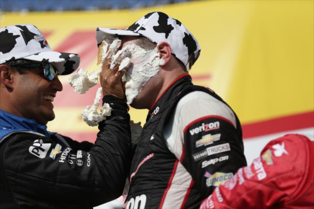 Teammate Juan Pablo Montoya smashes a cream puff into Will Power's face in Victory Circle at the Milwaukee Mile -- Photo by: Shawn Gritzmacher