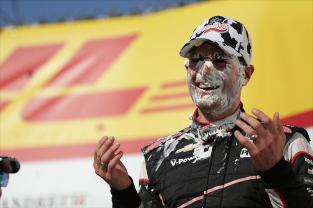 Will Power wears the sweet cream from a cream puff in Victory Circle after winning the ABC Supply Wisconsin 250 at the Milwaukee Mile -- Photo by: Shawn Gritzmacher