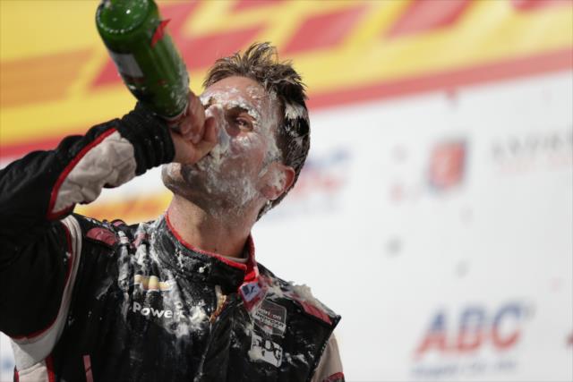 Will Power swigs champagne in Victory Circle after winning the ABC Supply Wisconsin 250 at the Milwaukee Mile -- Photo by: Shawn Gritzmacher