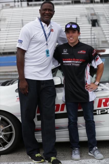 Dominique Wilkins poses with Honda pace car driver Martin Plowman after taking a hot lap ride around the Milwaukee Mile -- Photo by: Shawn Gritzmacher