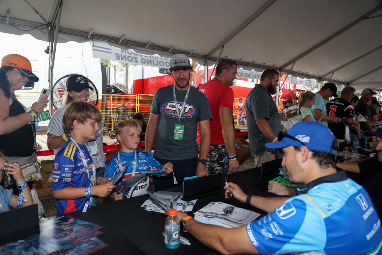 Graham Rahal signs an autograph for a fan - Big Machine Music City Grand Prix - By: Travis Hinkle -- Photo by: Travis Hinkle