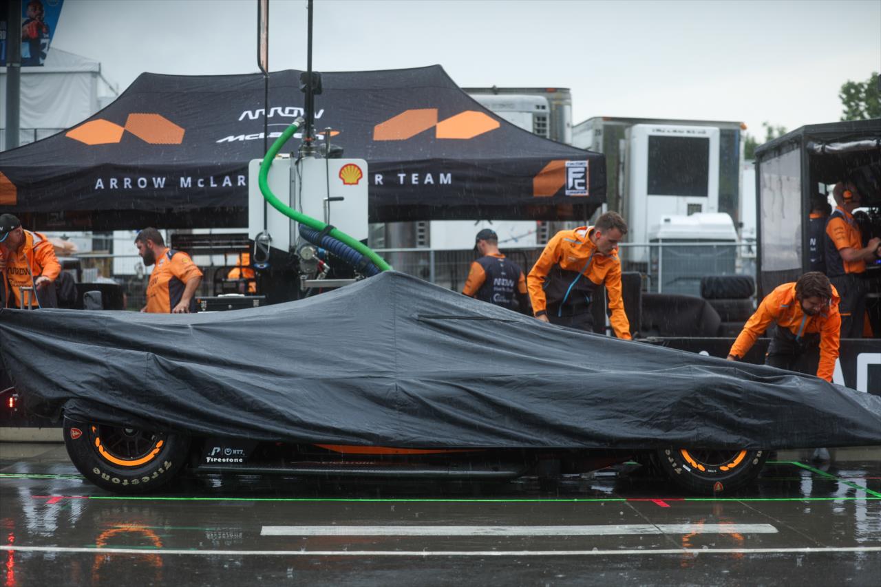 Arrow McLaren crew members covering the car of Pato O'Ward - Big Machine Music City Grand Prix - By: Chris Owens -- Photo by: Chris Owens