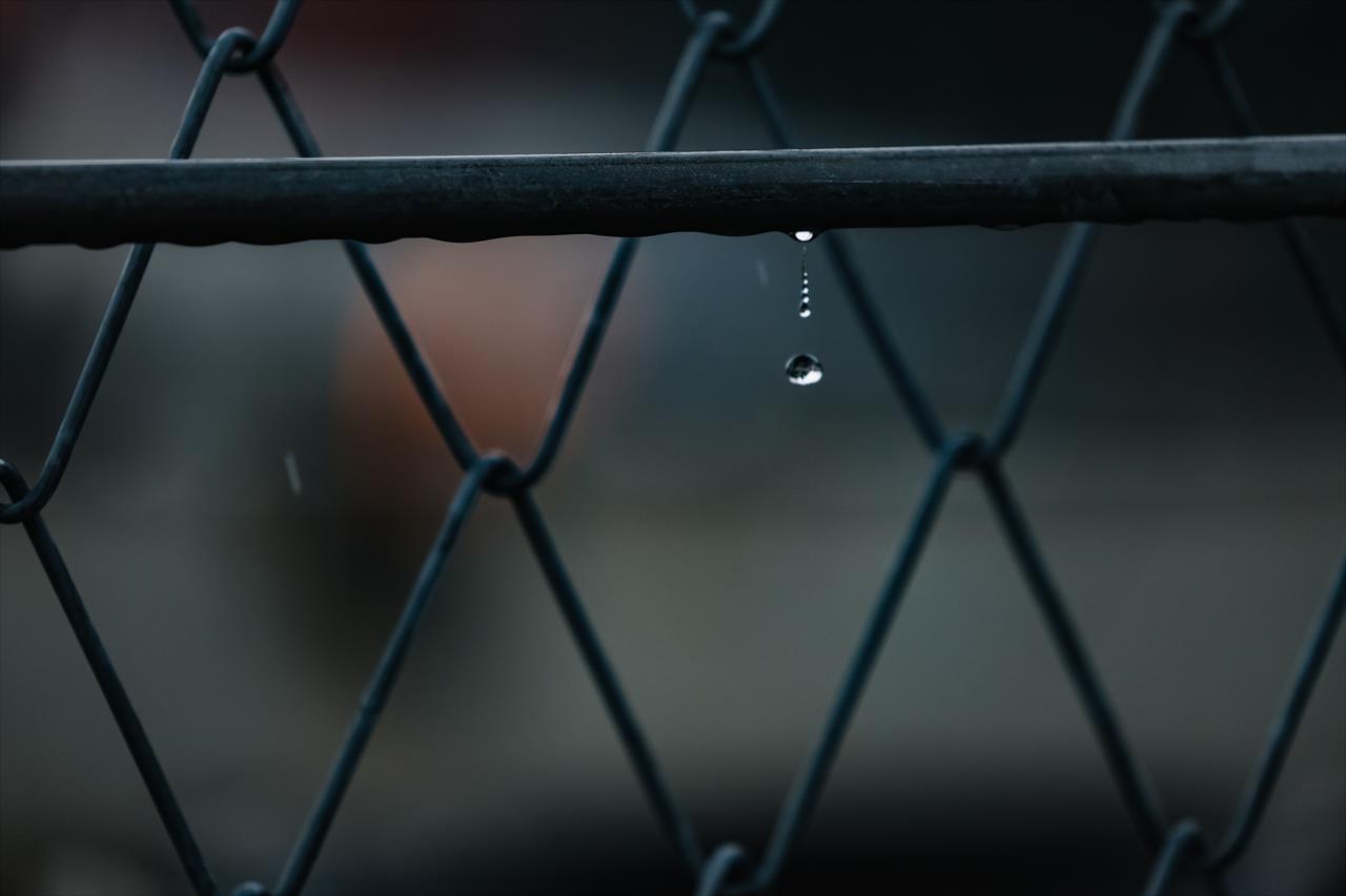 Rain drops drip from the fence - Big Machine Music City Grand Prix - By: Joe Skibinski -- Photo by: Joe Skibinski