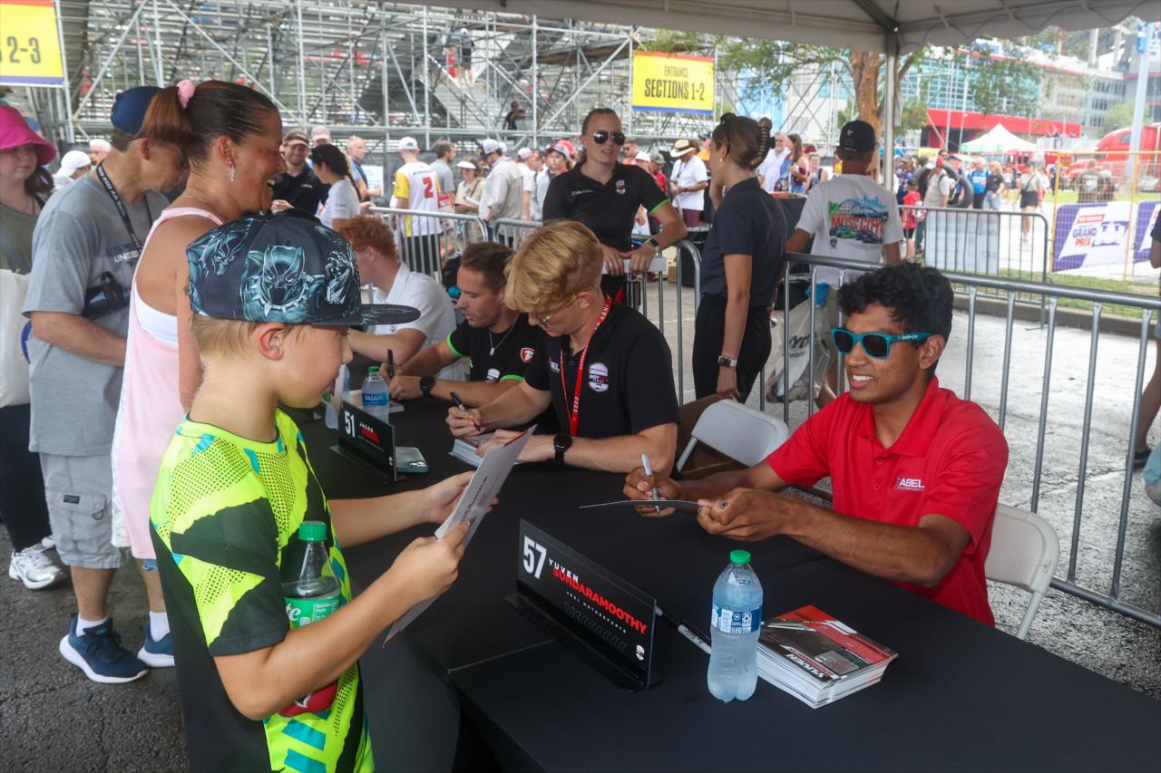 Yuven Sundaramoorthy signs an autograph for a fan - INDY NXT By Firestone Music City Grand Prix - By: Travis Hinkle -- Photo by: Travis Hinkle