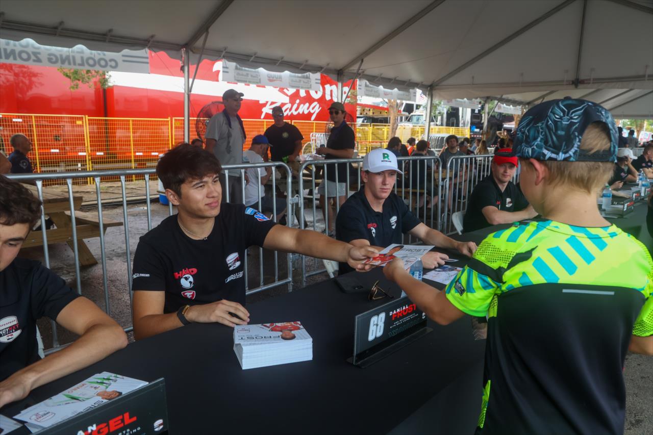 Danial Frost signs an autograph for a fan - INDY NXT By Firestone Music City Grand Prix - By: Travis Hinkle -- Photo by: Travis Hinkle
