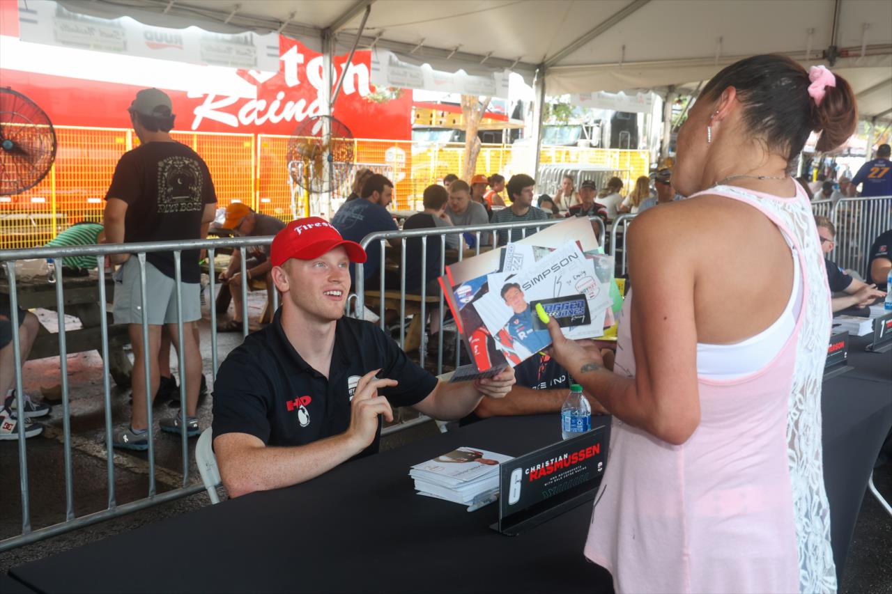 Christian Rasmussen signs an autograph for a fan - INDY NXT By Firestone Music City Grand Prix - By: Travis Hinkle -- Photo by: Travis Hinkle