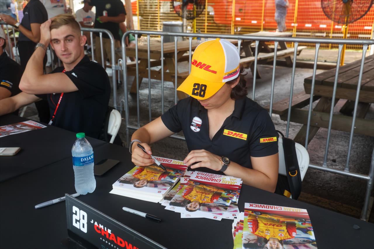 Jamie Chadwick signs an autograph for a fan - INDY NXT By Firestone Music City Grand Prix - By: Travis Hinkle -- Photo by: Travis Hinkle