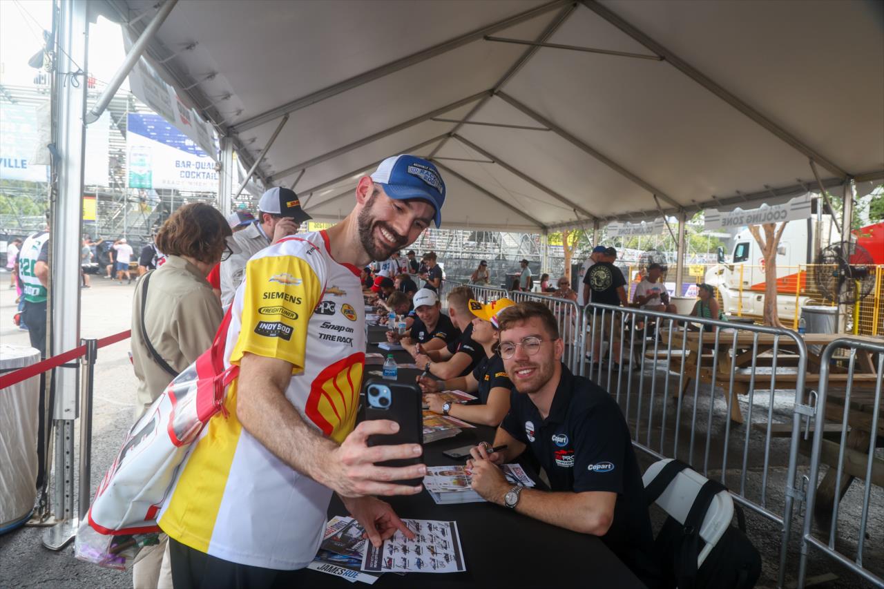 Louis Foster takes a photo with a fan - INDY NXT By Firestone Music City Grand Prix - By: Travis Hinkle -- Photo by: Travis Hinkle